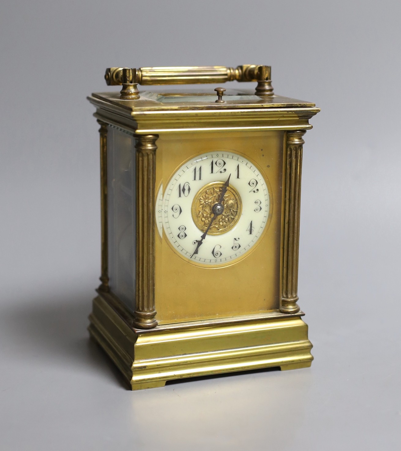 A French quarter repeating gilt brass carriage clock, 14 cms high